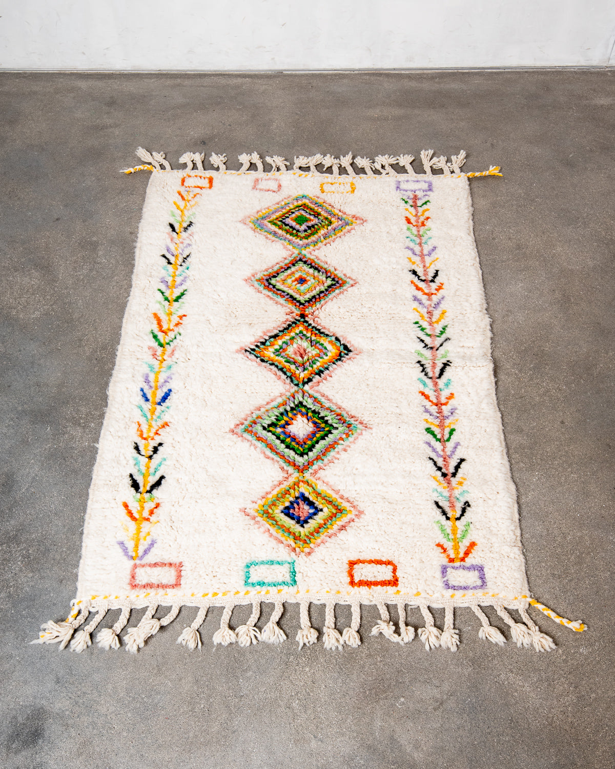 Modern, designer, handcrafted Berber rug from Morocco. Beniourain carpet with beautiful colours and patterns and fluffy wool texture.